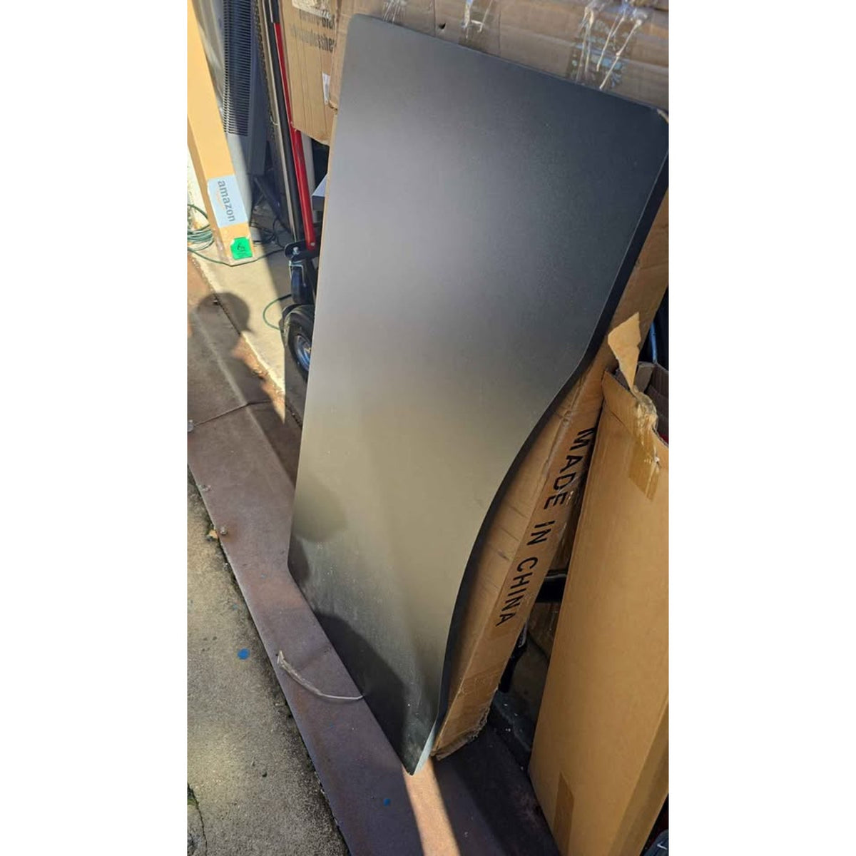 Black desk top with natural wood legs. 39.5" x 19 3/4"